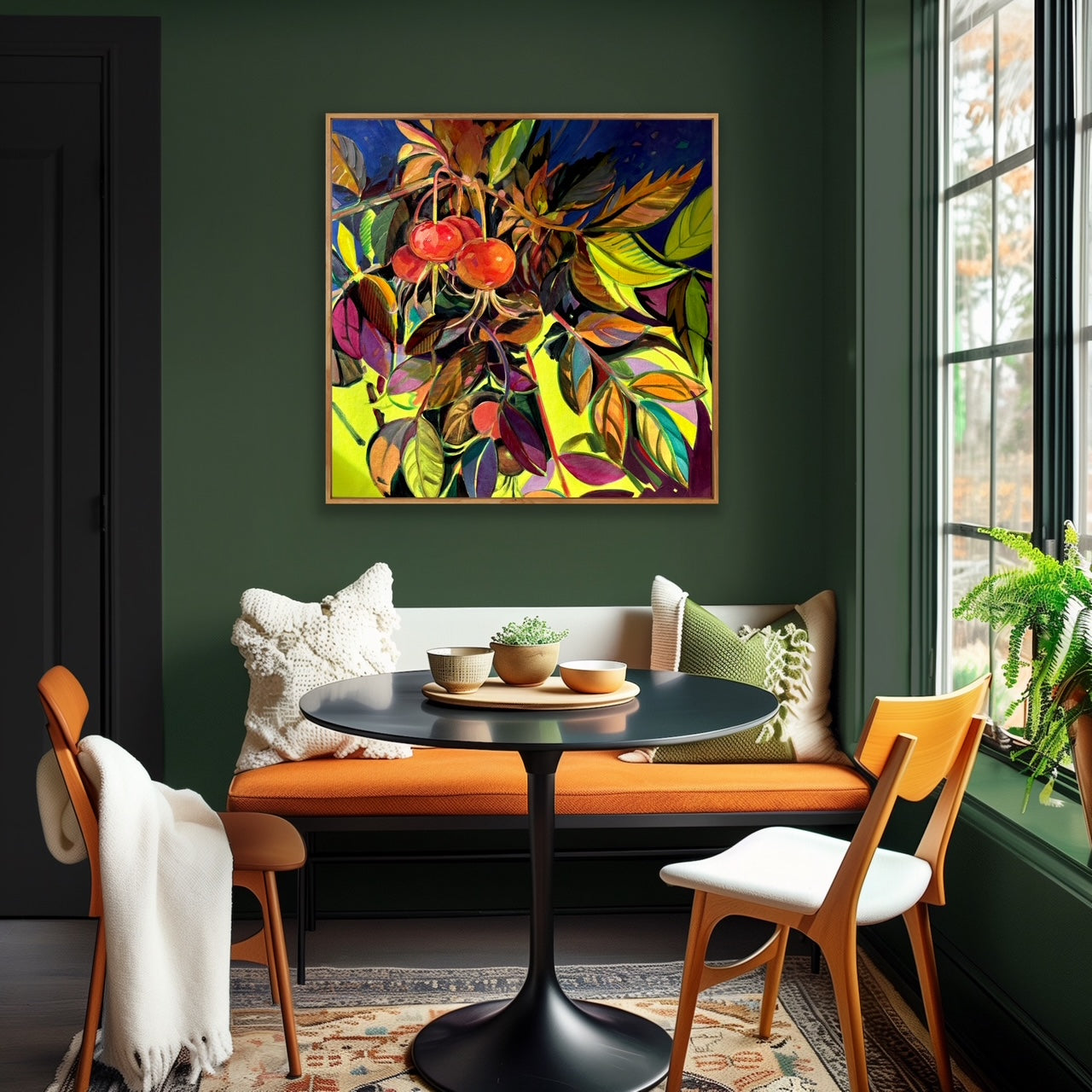 Colorful abstract painting on a green wall above a dining table with chairs.