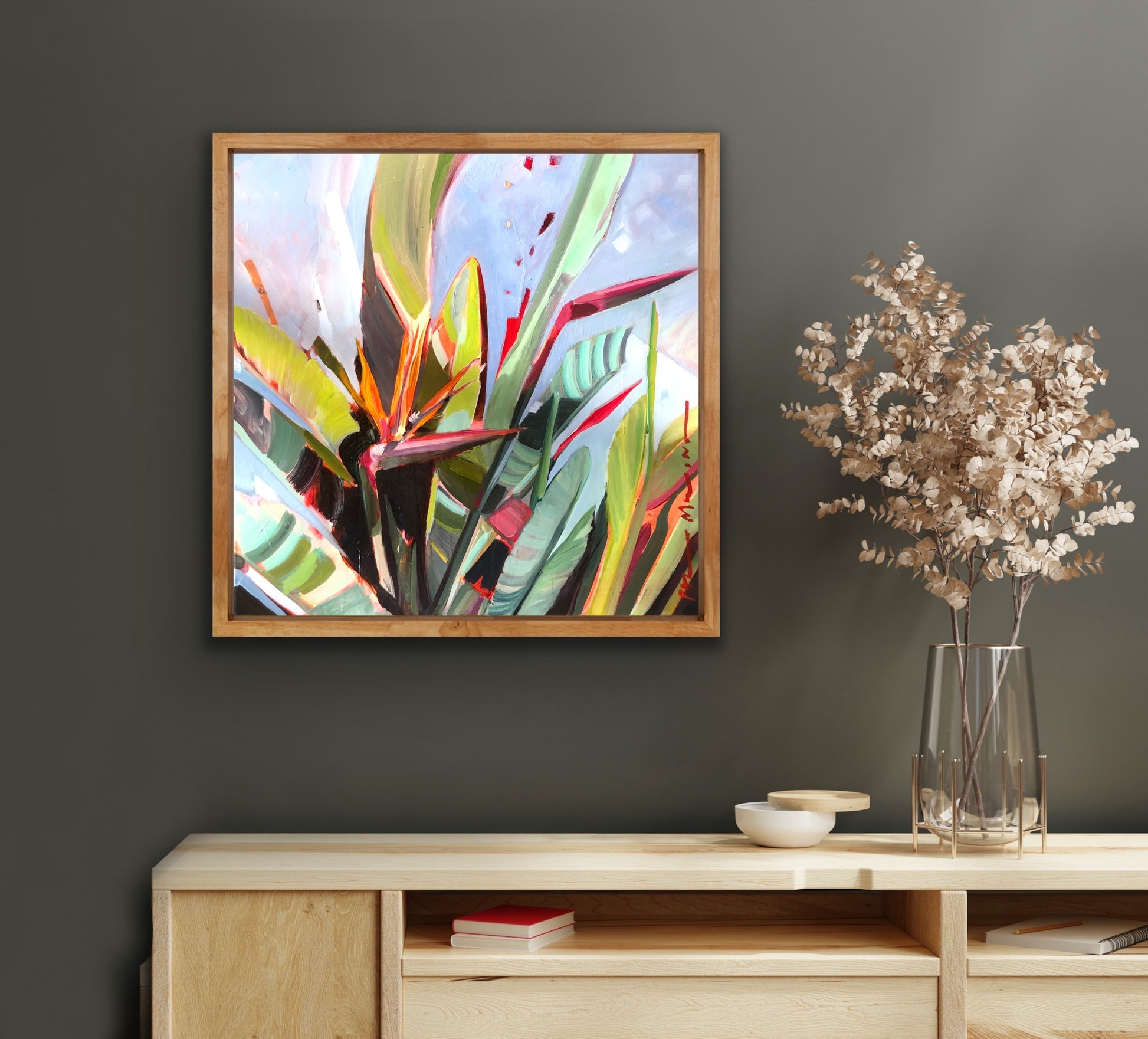 Bright Bird of paradise painting against a grey background wall.